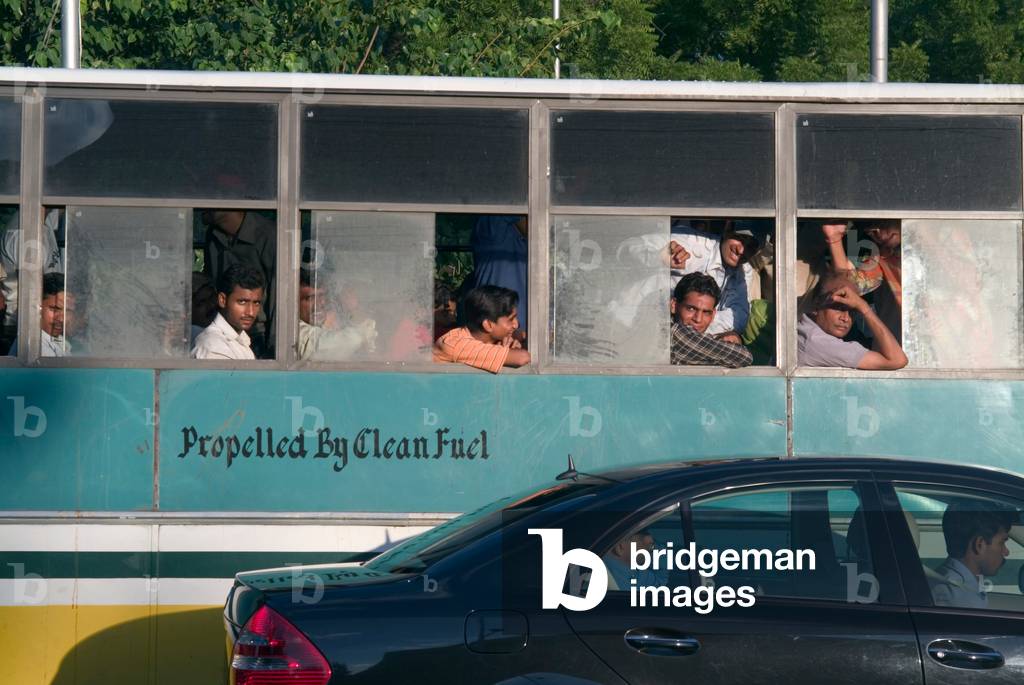 Passengers in gas-powered public transport bus (