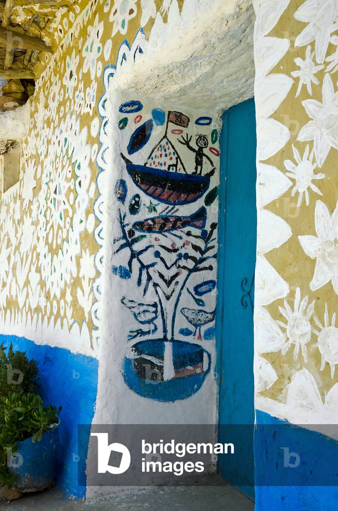 Symbolically  ('Baraka') painted house facade in Berber village in High Atlas mountains, Tizgui, Mentaga river valley, High Atlas, Taroudant Province, Souss-Massa-Draa Region, Morocco (photo)