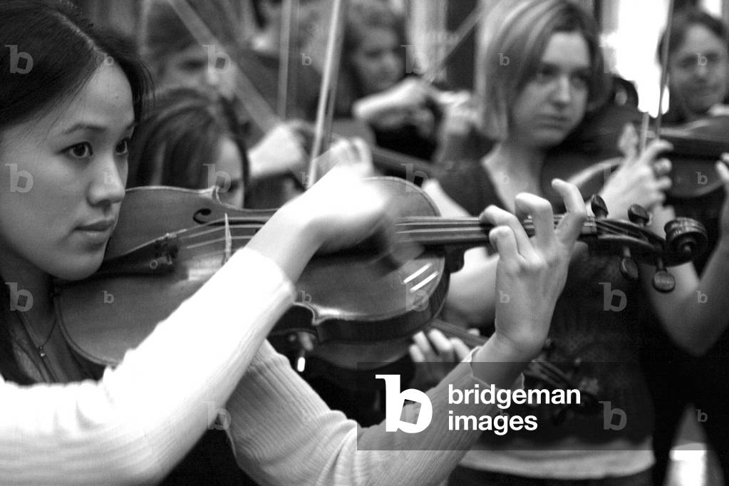 A  violin player in rehearsal for 'Get Carter!' based on the music of Elliott Carter, at the Barbican Centre, London, 15 January 2006