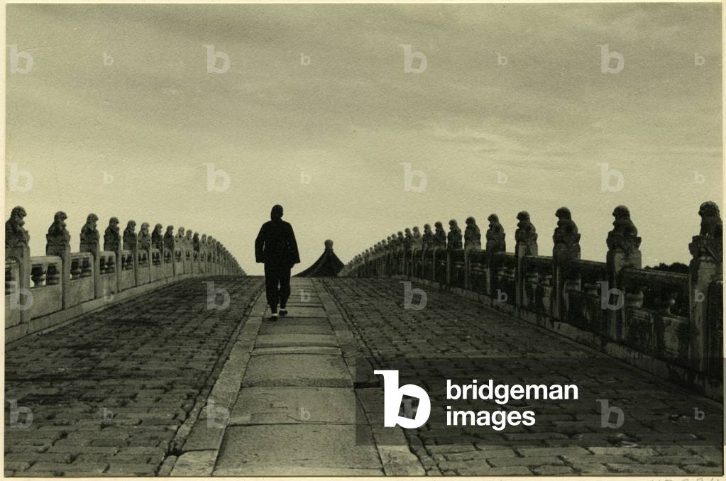 A man crossing the Seventeen–Arch Bridge, connecting the eastern shore of Kunming Lake with Nanhu Island, Beijing, 1937 (bromide print)