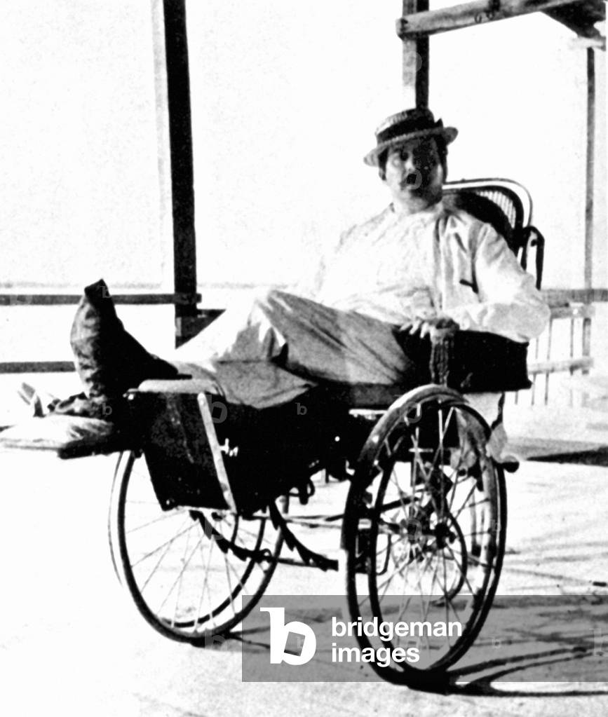 Giacomo Puccini in wheelchair,   Italian composer: 22 December 1858 - 29 November 1924