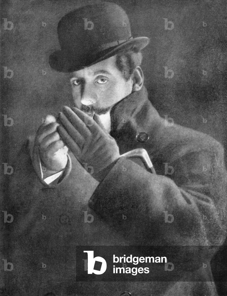 Giacomo Puccini lighting a cigarette in London 1911