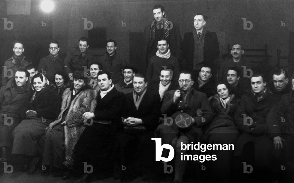 French singer Edith Piaf (1st row, 3rf from r) in Germany in august september 1943 attending performance by prisoners of a camp