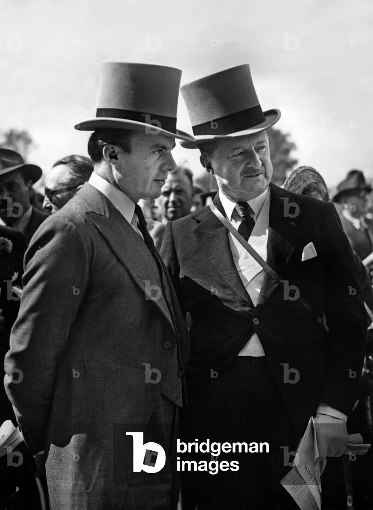Prince Ali Khan with Duff Cooper (english ambassador in Paris) at horse race in Chantilly, France (prix de Diane), june 6, 1949