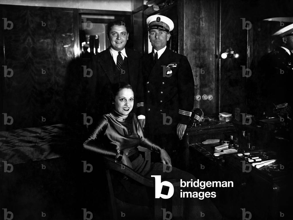 French singer Lucienne Boyer (1901-1983) in her cabin with captain of the liner