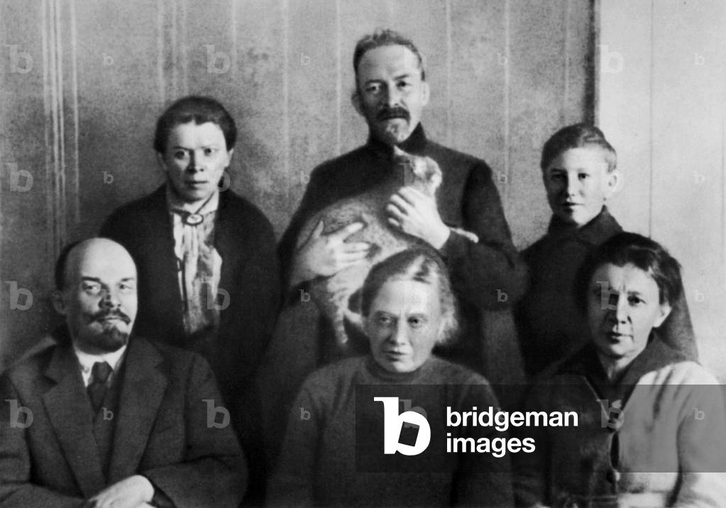 Lenin with his family at Kremlin, 1920: front: Lenin (Vladimir Ilyich Ulyanov), his wife Nadezhda Krupskaya, his sister Anna Ulyanova ; standing: his sister Maria Ulyanova, his brother Dimitri Ulyanov, Georgij Losgatschew (adoptive son of Anna Ulyanova)