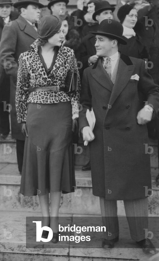 Elegant woman wearing fur coat in exotic leopard skin, Longchamps, Polo de Paris, March 1931 (b/w photo)