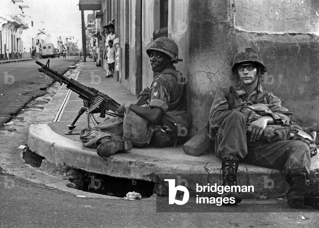 2 soldiers of an interamerican force guard a street corner in the former rebel sector of Santo Domingo october 25, 1965 (civil war)