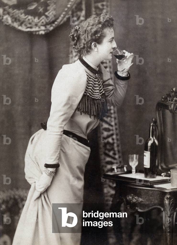 Woman drinking wine, c. 1910, photo Reutlinger