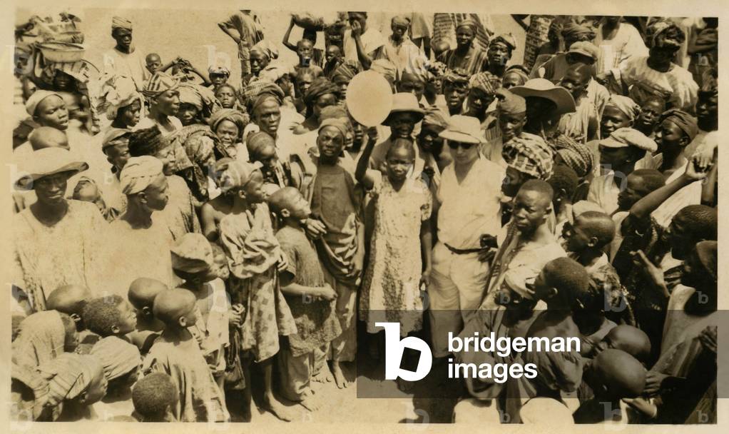 Nigeria, 30's : Andre Vidal (from the CFAO) with africans , 1930s (b/w photo)