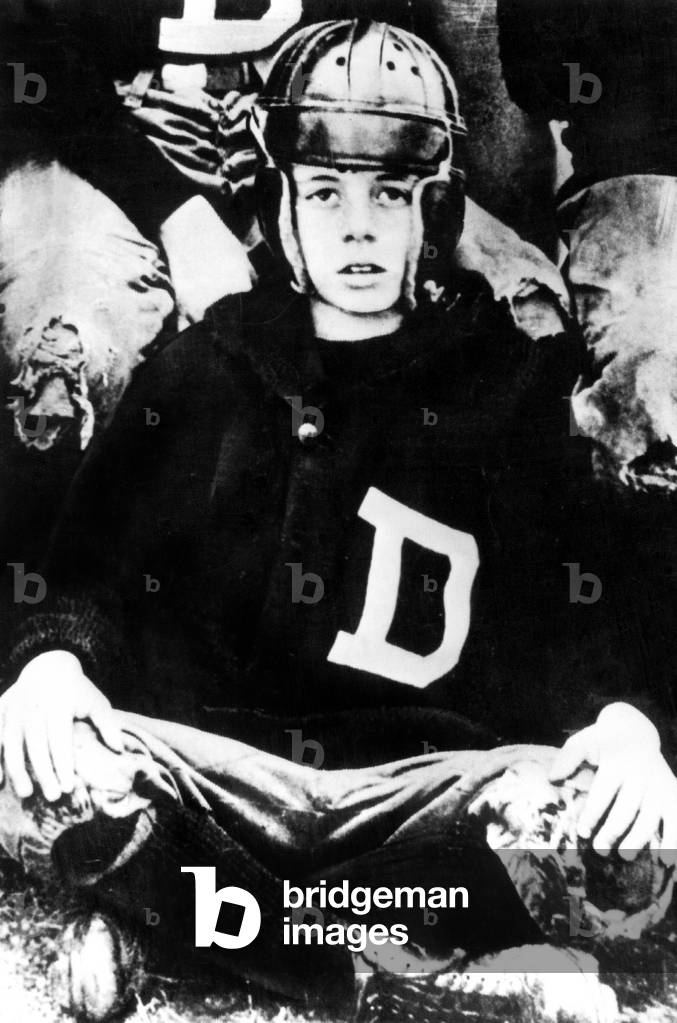 Young John Kennedy at 10 wearing a football suit, 1927 (photo)