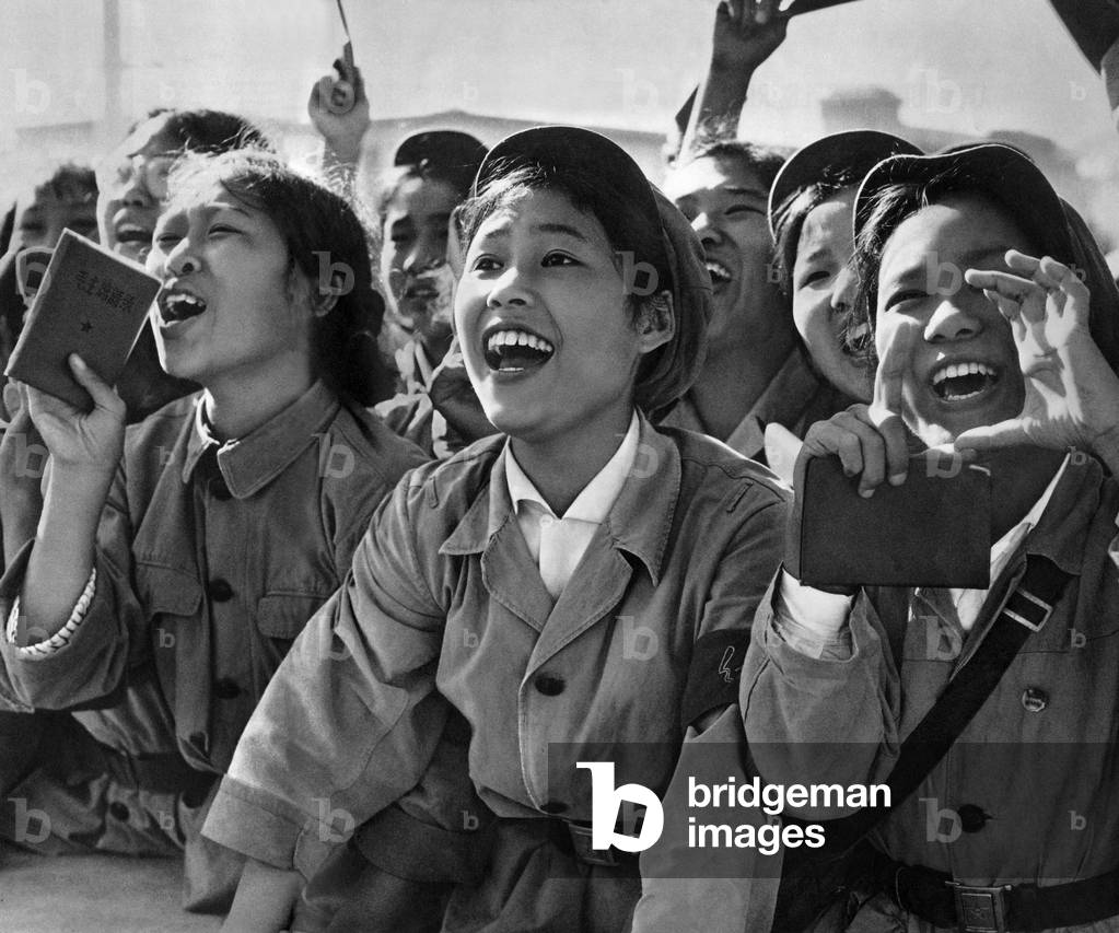 Members of red guards, holding The Little Red Book, during the celebration of the Cultural Revolution in Pekin, 1966 (b/w photo)
