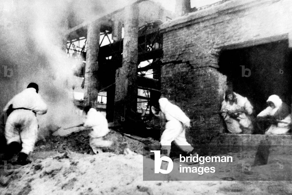 Soviet soldiers in Stalingrad (USSR) attacking last german resistance in a factory in ruins although german marshal von Paulus capitulated on february 2, 1943