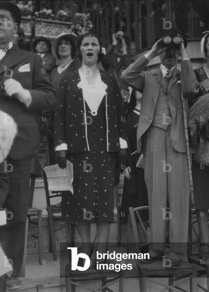 A couple attending a horse race in Auteuil, Paris, June 13, 1931