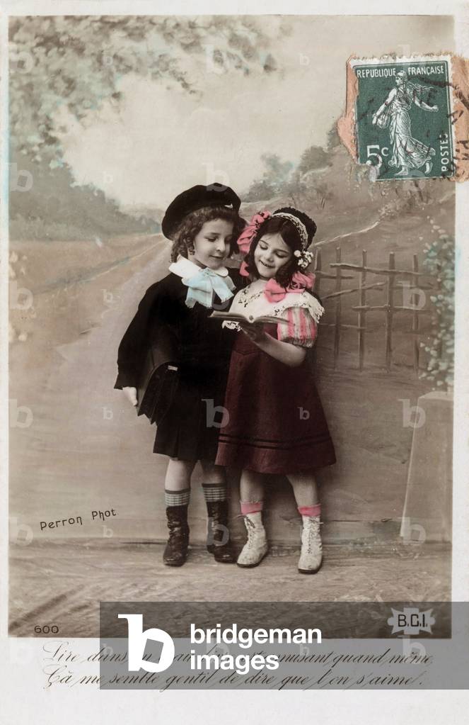Little boy and little girl reading a book together, Postcard, France, c. 1919