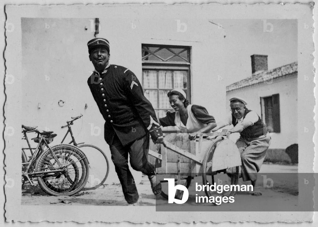 Friendly atmosphere for the Freton family on holidays in 1936, France (play with a wheelbarrow)