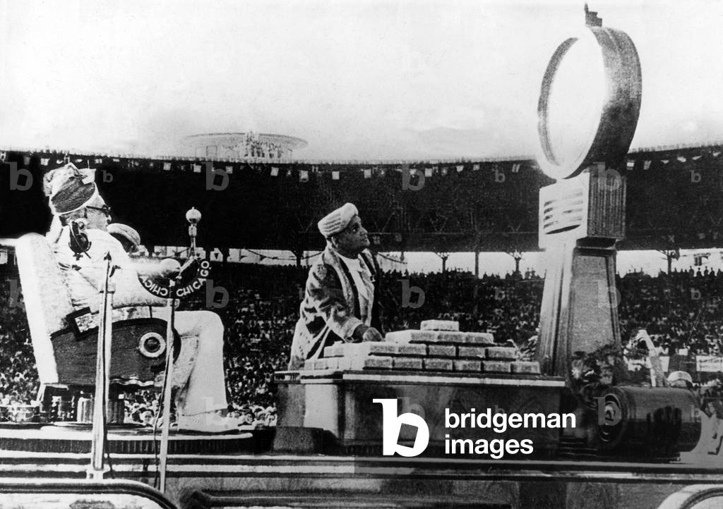 Aga Khan III  receiving his weight in gold, 1946 (b/w photo)