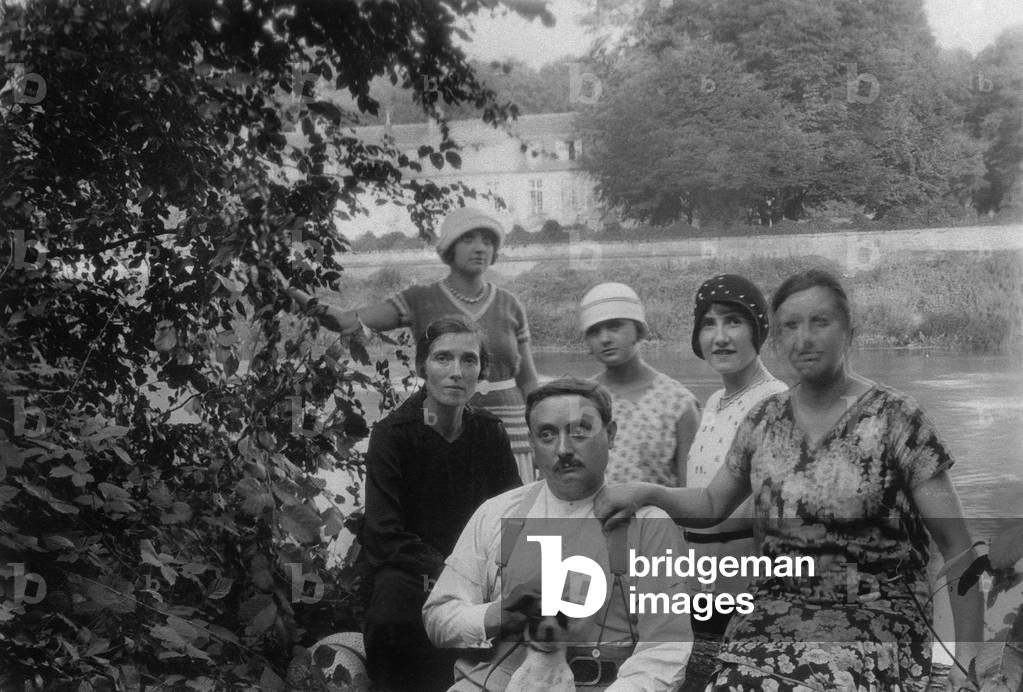 Members of a family near a river, c. 1925 (photo)