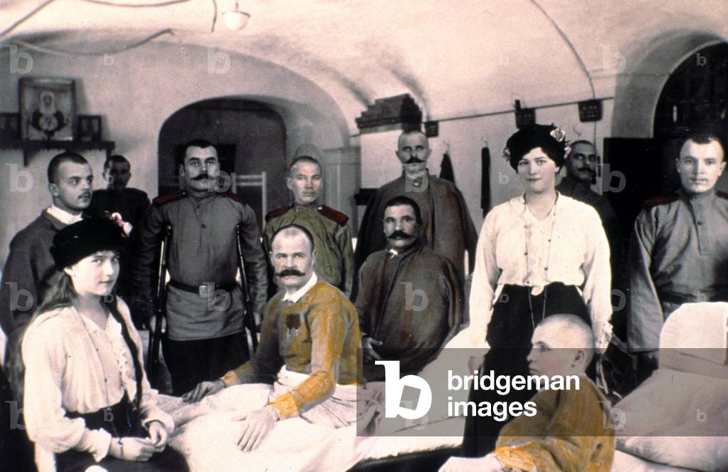Grand duchesses of Russia Anastasia (l) and Maria (daughters of czar NicolasII) visiting wounded soldiers, c. 1915