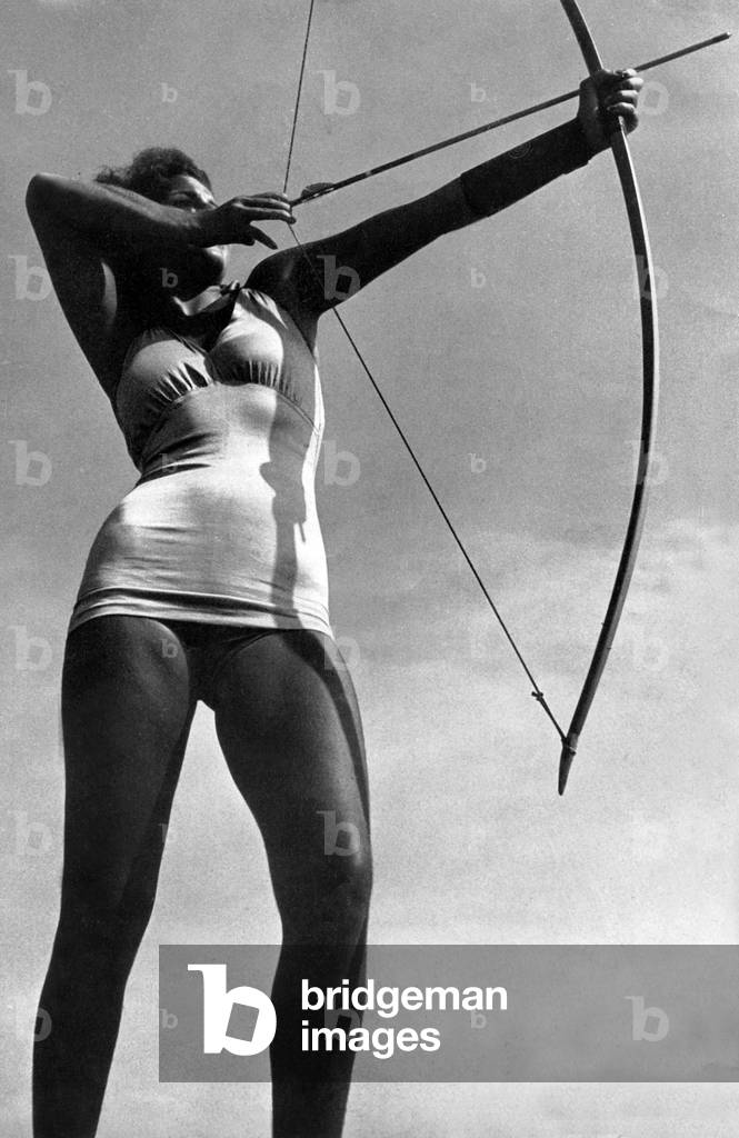 Woman making archery, picture from french magazine 