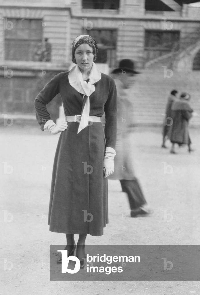 Elegant and pretty woman at the Longchamps races (Paris Polo) in March 1931