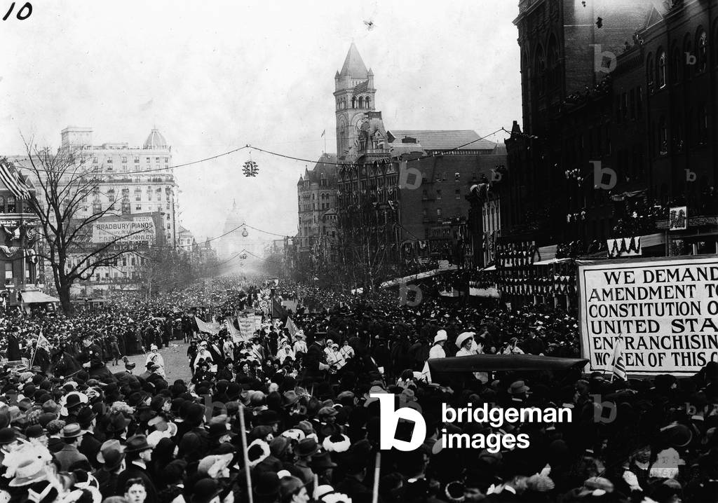 Mounted troops clear Pennsylvania Avenue so the womens suffrage parade can continue, Washington D.C., March 3, 1913 (b/w photo)