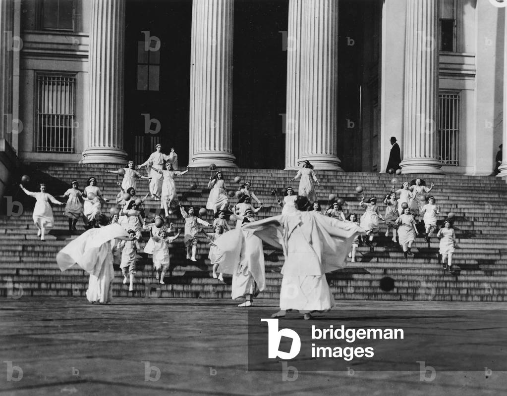 Young girls descend the Treasury Building steps during the womens suffrage tableau, Washington D.C., March 3, 1913 (b/w photo)