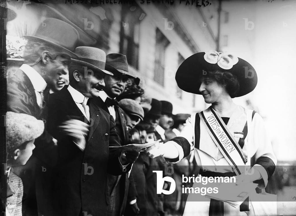 Suffragist Inez Milholland selling literature to spectators before the New York City womens suffrage parade, May 6, 1911 (b/w photo)