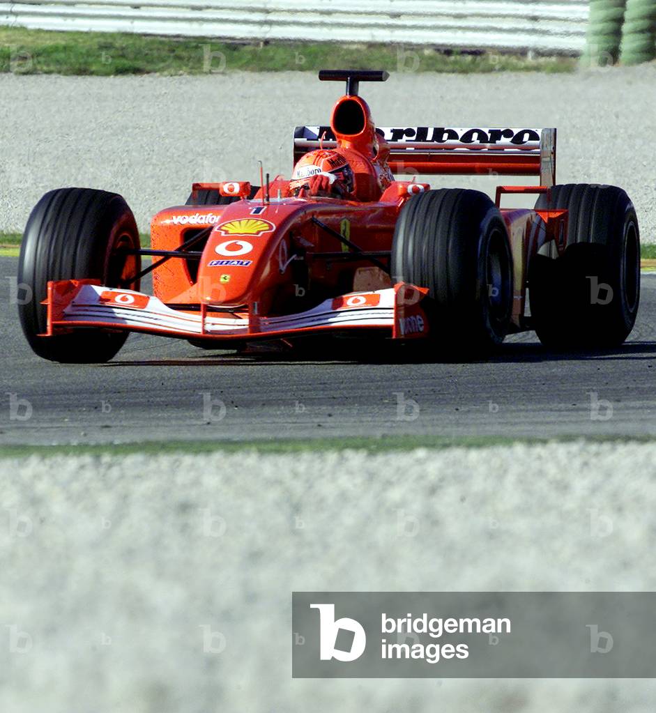 Image of GERMAN FORMULA ONE WORLD CHAMPION MICHAEL SCHUMACHER SPEEDS