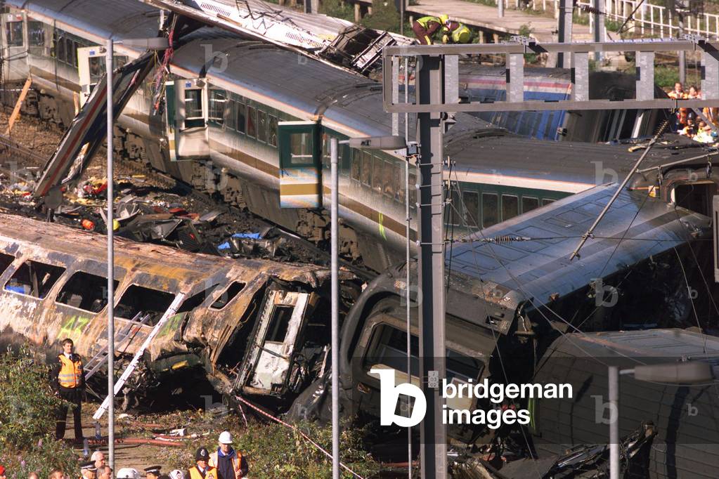 Image of Rescue workers attend the scene of a train crash in