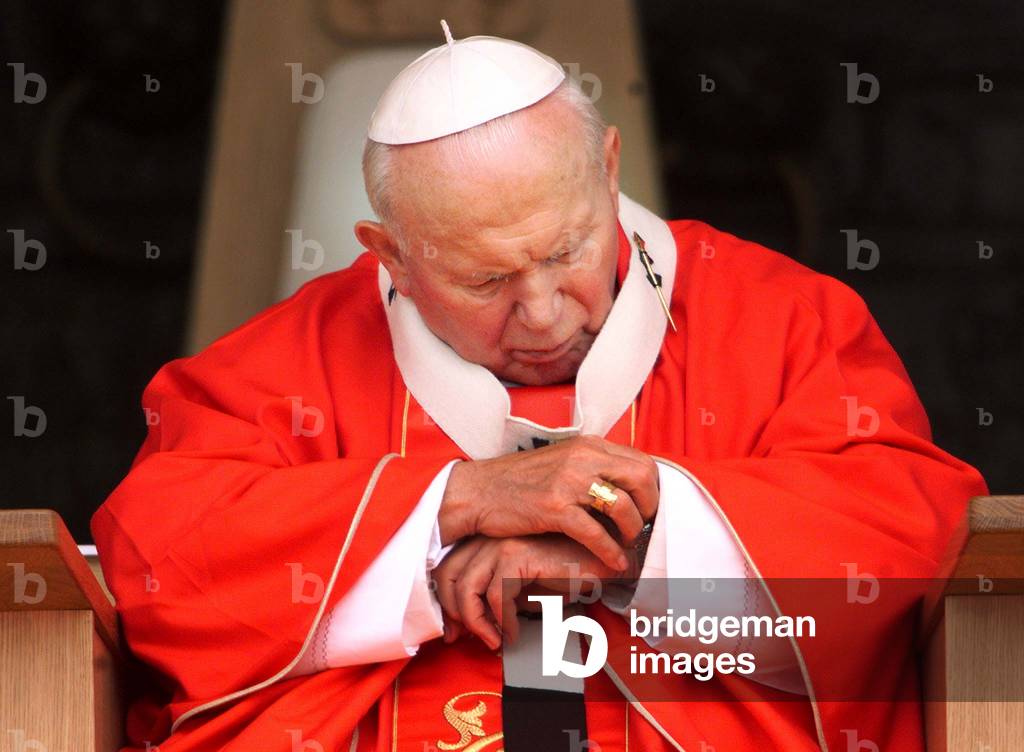 Pope John Paul II looks at his watch at the end of a holy mass in Bydgoszcz June 7 on the third day .., 1999-0