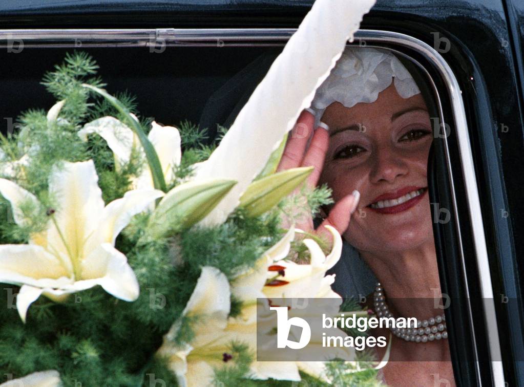 Romania's 1976 Olympic gold medal-winning gymnast Nadia Comaneci waves to the crowd as she leaves th.., 1996-0