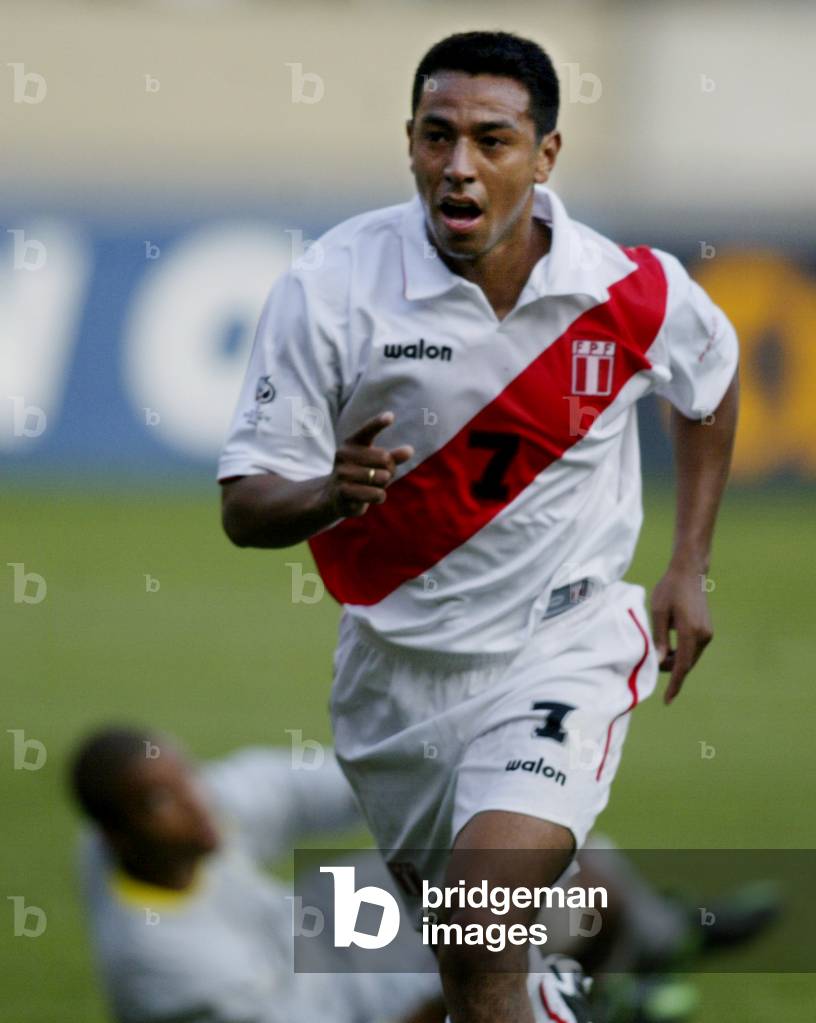 Image of PERUVIAN SOCCER PLAYER SOLANO CELEBRATES FIRST GOAL AGAINST  BRAZIL, 2003