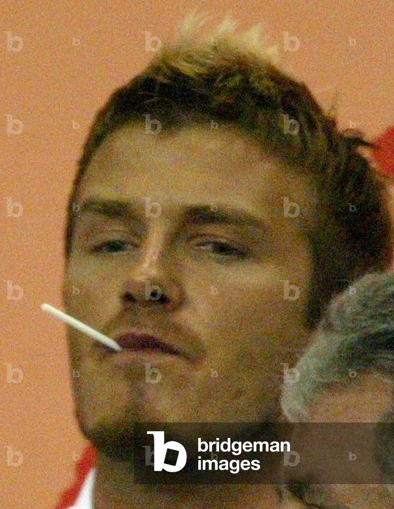 david beckham smoking cigarettes Image of ENGLAND'S DAVID BECKHAM WATCHES SECOND ROUND MATCH IN KOBE,  2002-06-17