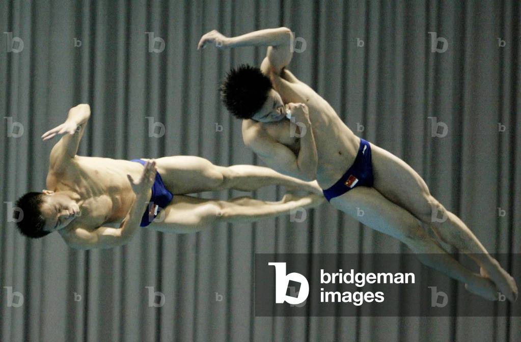 Image of WANG AND PENG OF CHINA PERFORM IN THE MEN'S THREE