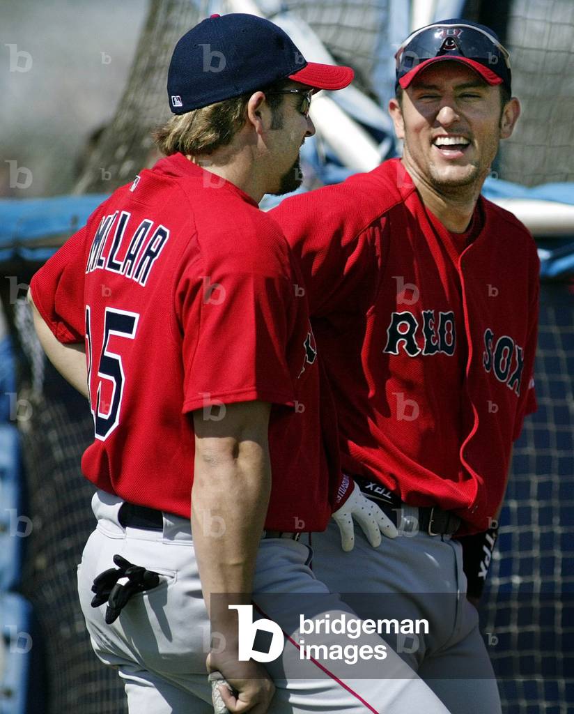 BOSTON RED SOX SHORTSTOP GARCIAPARRA LAUGHS WITH OUTFIELDER MILLAR AT
SPRING TRAINING, 2003-02-19 (photo)