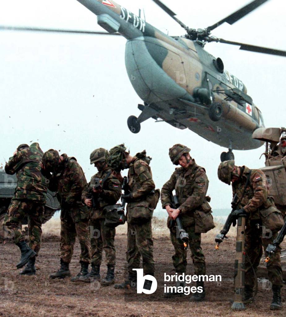 Image of Dutch soldiers from the 41st Light Brigade wait in front
