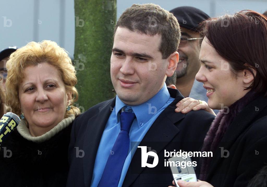Image of Algerian-born pilot Lotfi Raissi (C) smiles with his wife Sonia