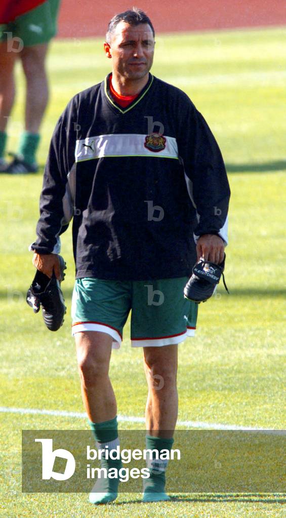 Bulgaria's striker Hristo Stoichkov holds his soccer shoes as he leaves an afternoon practice sessio.., 1998-0