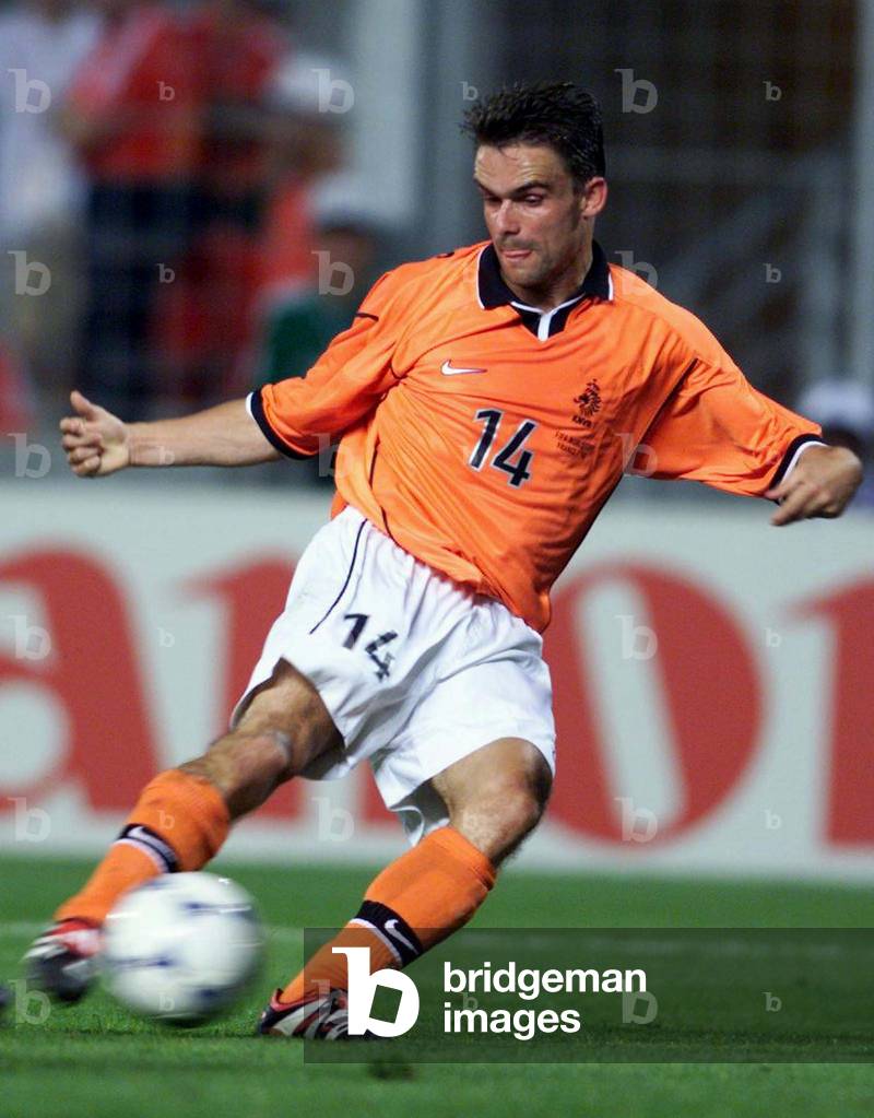 Image of Netherlands' Marc Overmars strikes the ball to score