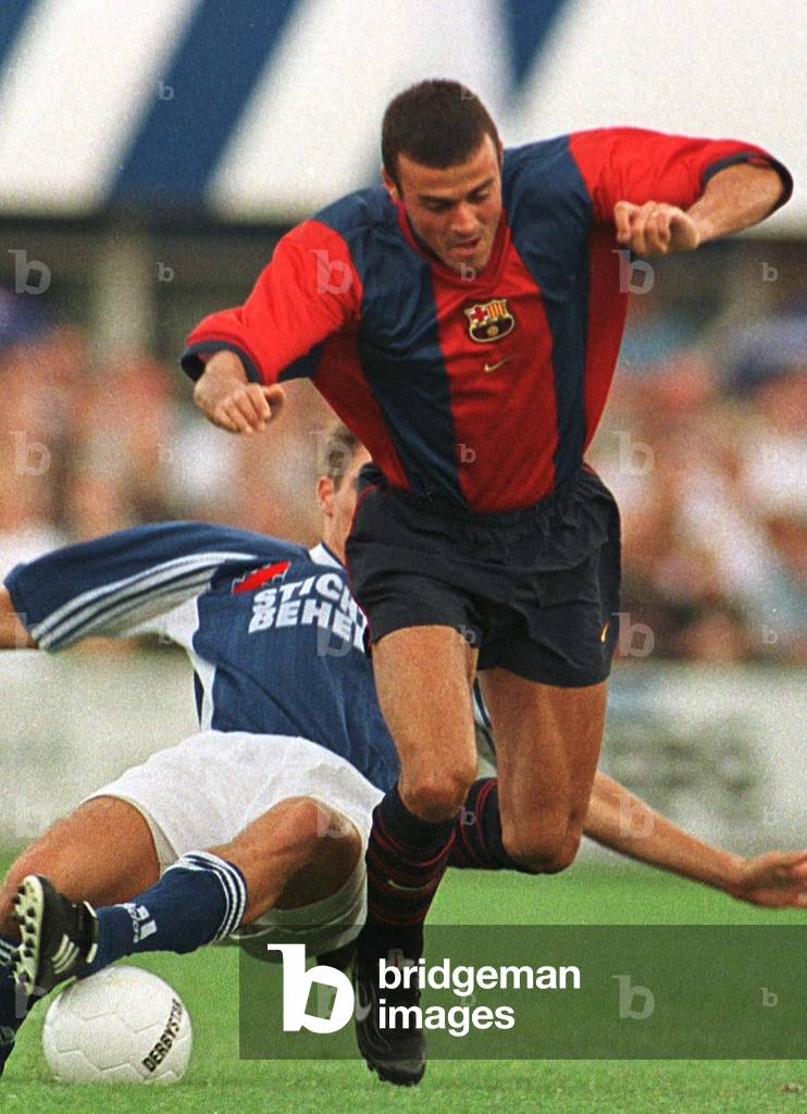 Image of LUIS ENRIQUE OF BARCELONA IS TACKLED DURING FRIENDLY