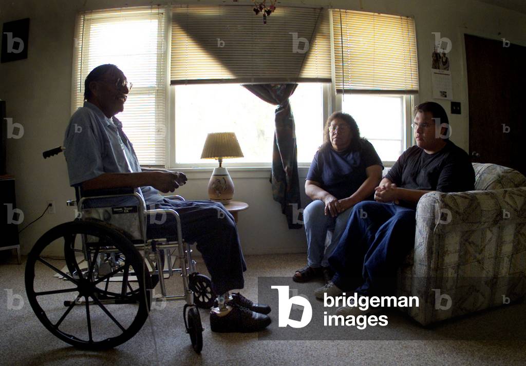 Caron Rooks Image of Paul Rooks (L), 49, his wife Ester (C) and son