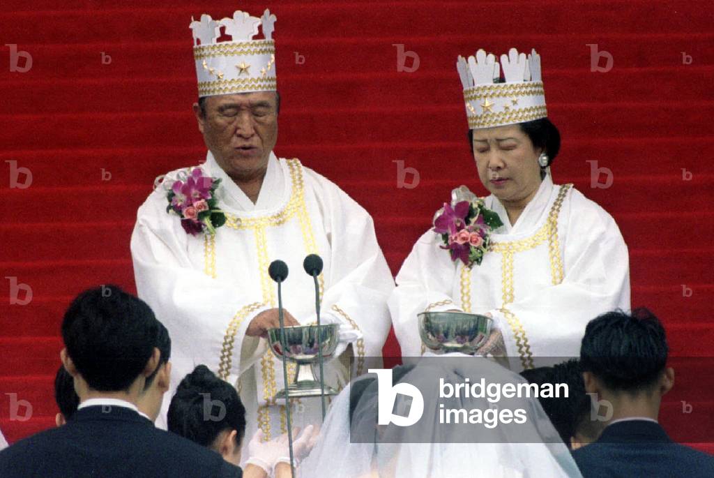 Image of Unification Church leader Sun-myung Moon (L) and his wife Hak-ja