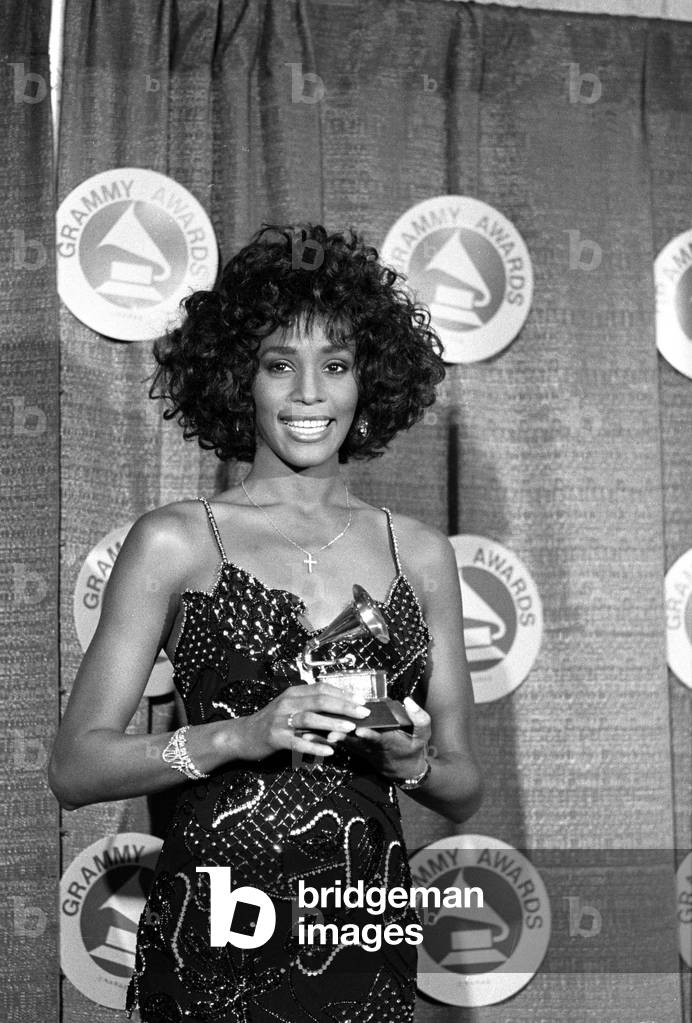 Image of Houston poses with her Grammy after she was named Best