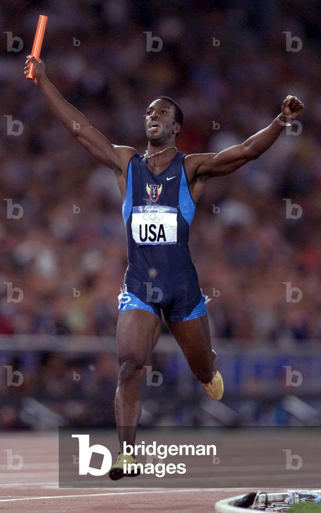 Image of US JOHNSON CROSSES THE LINE TO WIN THE 4X400M RELAY