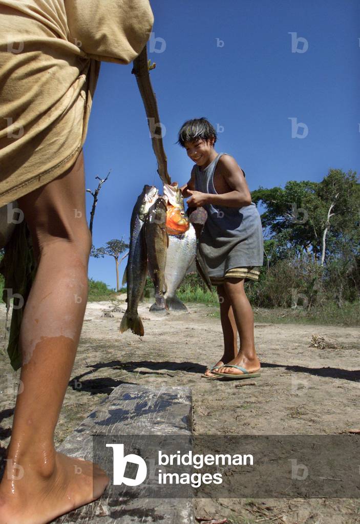 Image of YOUNG YAWALAPITI TRIBE MEMBERS AFTER SUCCESSFUL FISHING TRIP