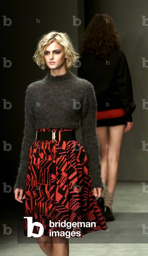 Image of MODELS WEAR OUTFITS AS PART OF MIU MIU SPRING/SUMMER  