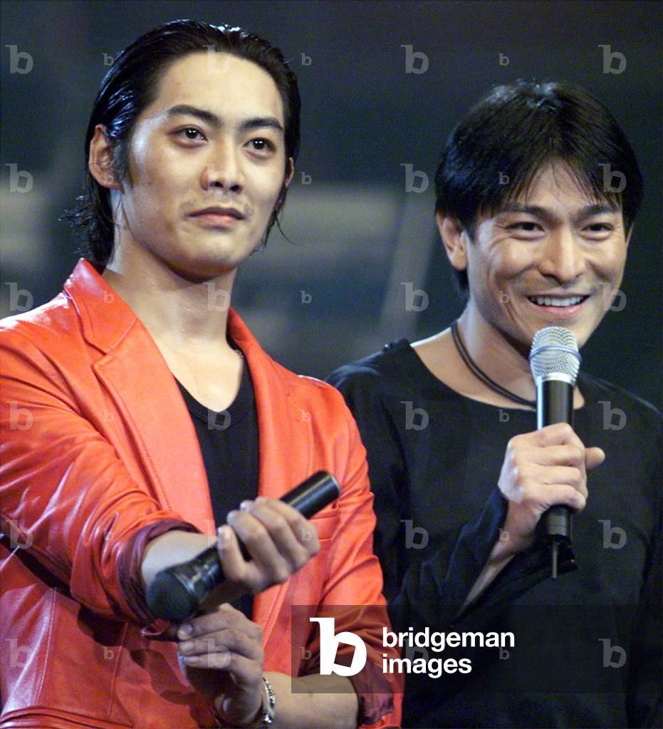 Image of HONG KONG ACTOR-SINGER ANDY LAU GESTURES IN A CONCERT OF