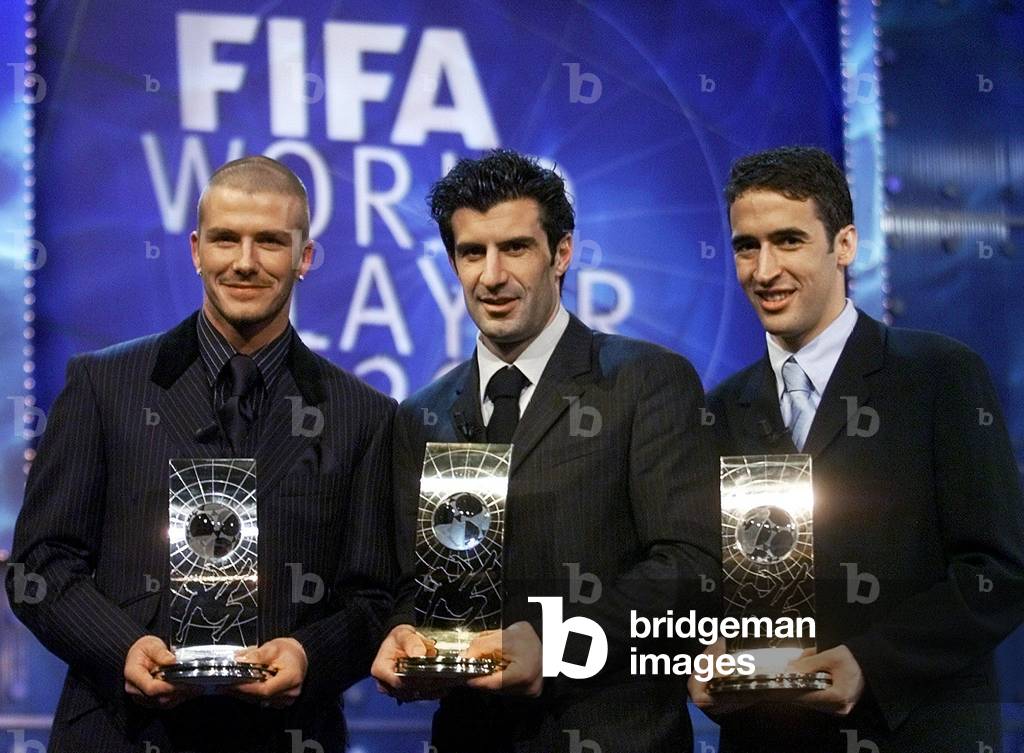 Image of Portugal's Luis Figo (C) poses with the FIFA World Player