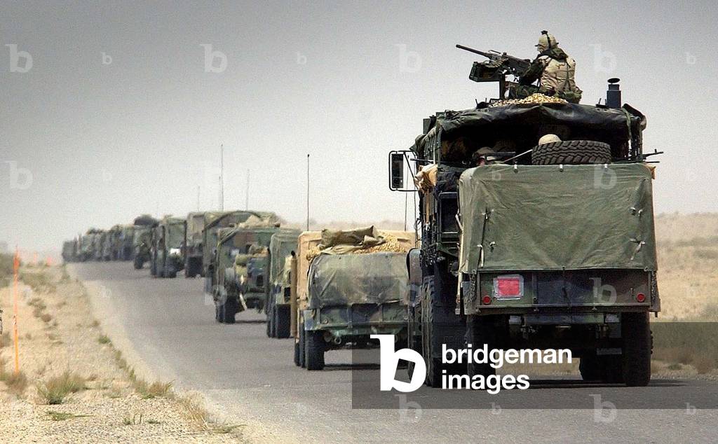 A CONVOY OF US MILITARY VEHICLES TRAVELS ACROSS THE KUWAITI BORDER INTO
SOUTHERN IRAQ, 2003-03-20 (photo)